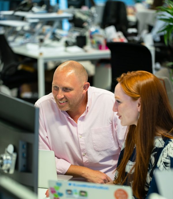 IT specialist setting up a workstation with a client